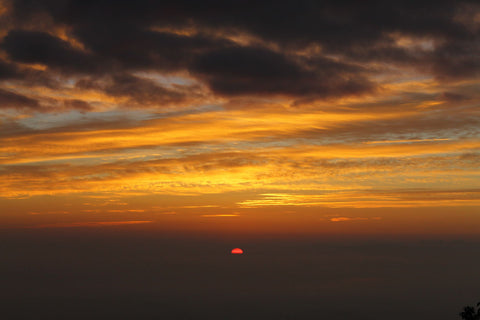 Orange Ball Among The Clouds by Ananthatejas Raghavan