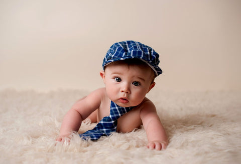 Adorable Baby In Blue Cap And Tie by Sina