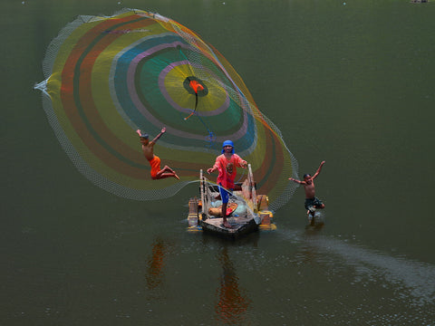 Spreading A Fish Net And Jump - Life Size Posters