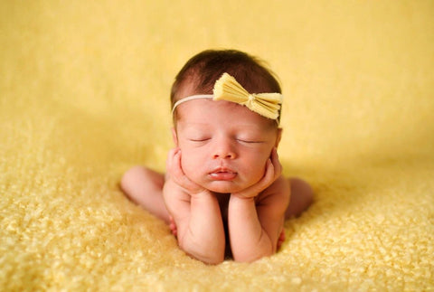 Adorable Newborn Baby Girl With Yellow Ribbon - Art Prints by Sina