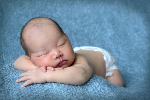 Newborn Baby Sleeping Without A Care In The World by Sina