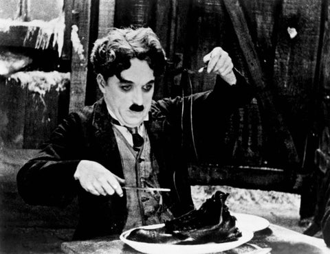 The Gold Rush - Shoe Eating Scene - Charlie Chaplin - Hollywood Classic Comedy English Movie Still Poster by Jerry
