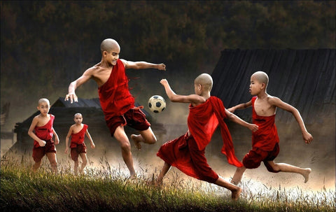 Young Monks Playing Football - Framed Prints