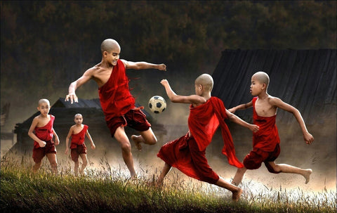 Young Monks Playing Football - Framed Prints by Tallenge Store